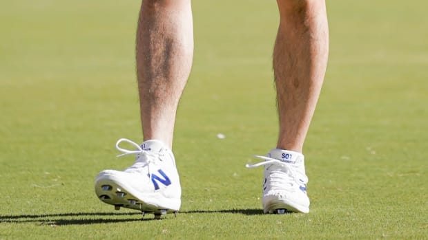 Shohei Ohtani's white and blue New Balance cleats during practice.